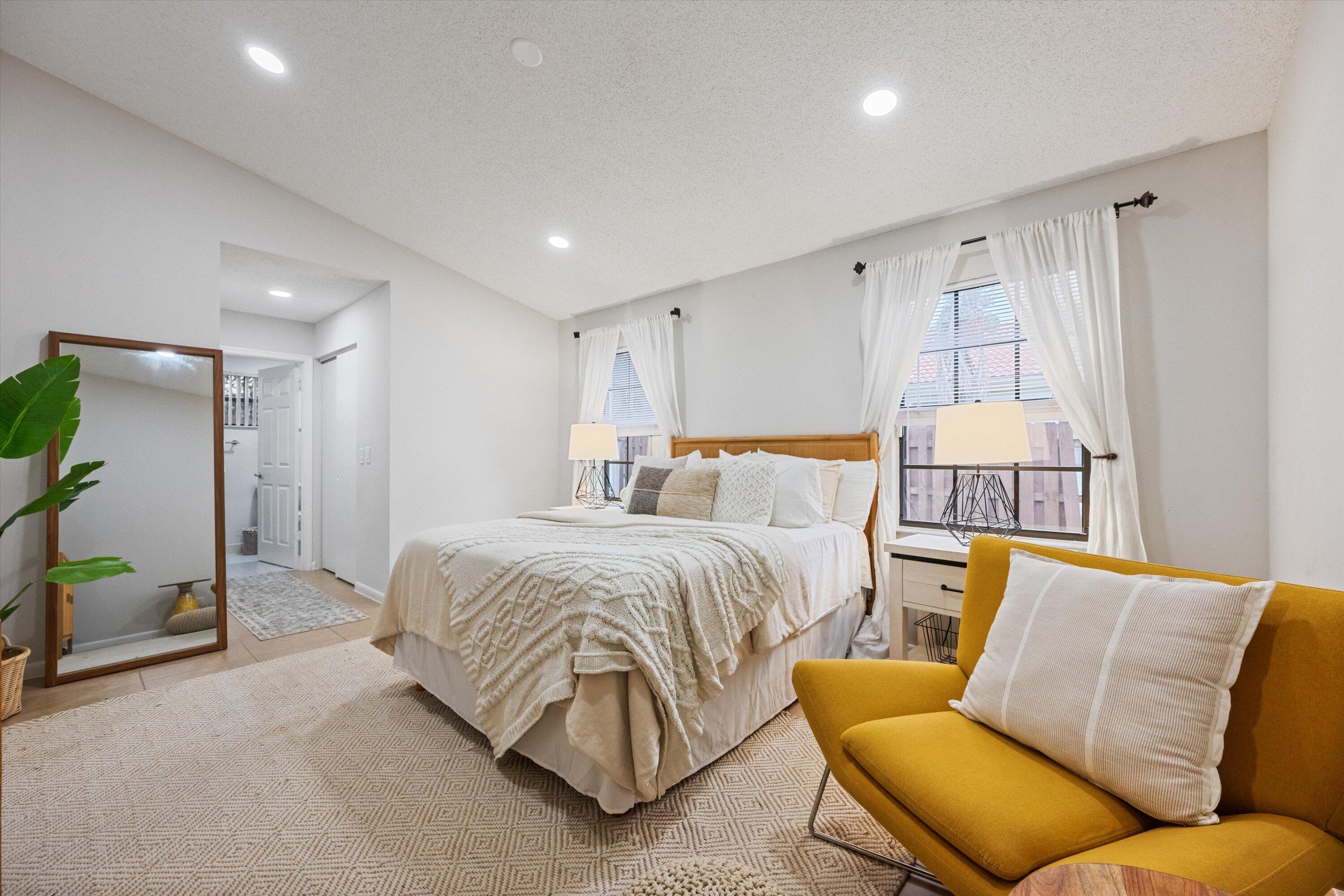 1769 Harborside Circle Wellington, FL 33414 - Photo 16 of 34 a bedroom with a bed and couch