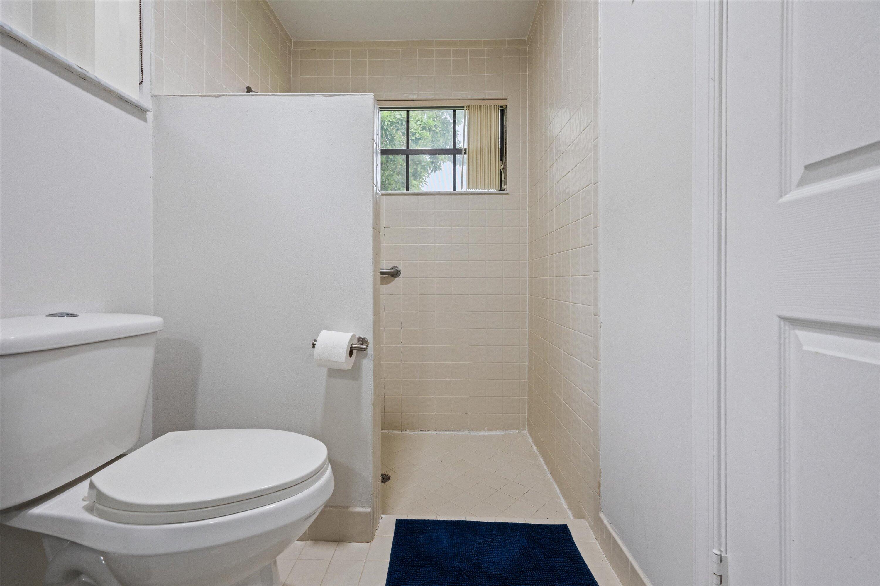 1769 Harborside Circle Wellington, FL 33414 - Photo 20 of 34 a white toilet sitting next to a sink