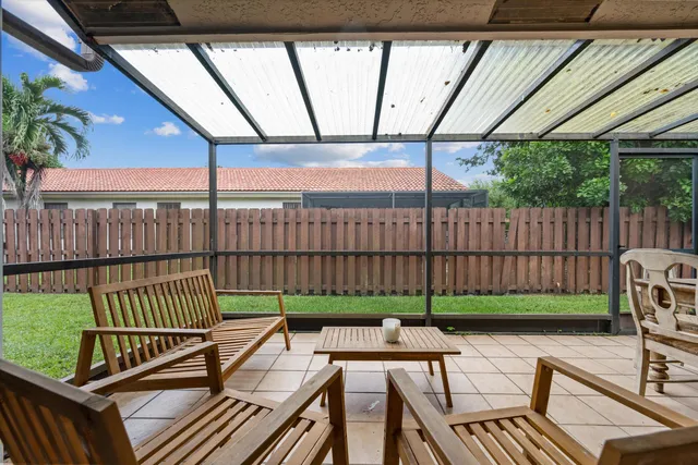 a view of a roof deck with wooden fence