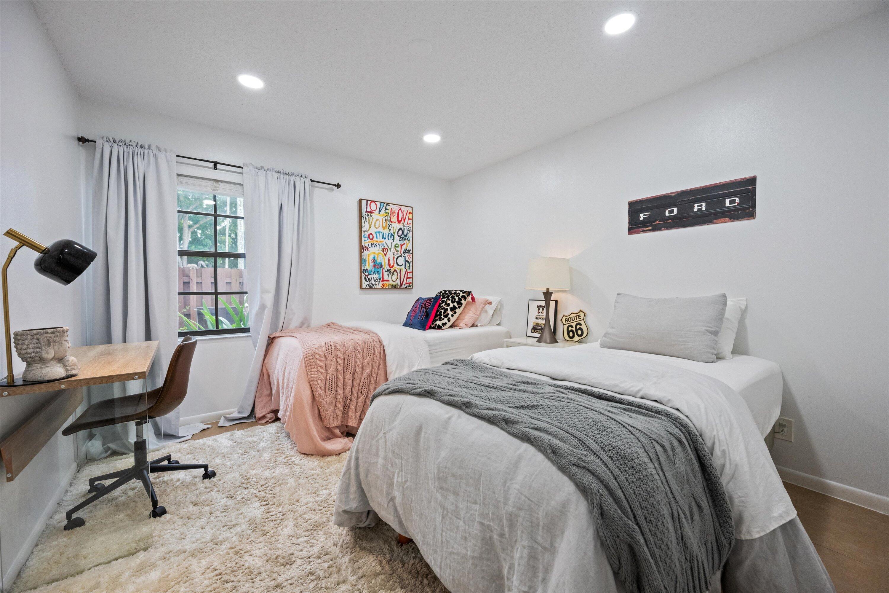 1769 Harborside Circle Wellington, FL 33414 - Photo 22 of 34 a bedroom with two beds and a desk