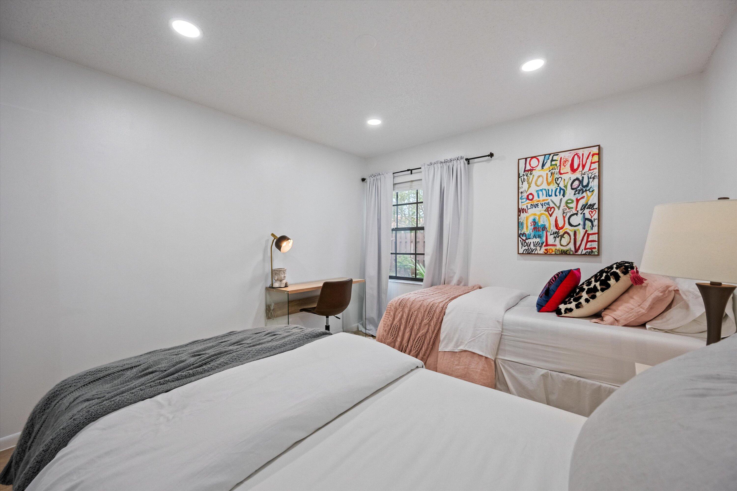 1769 Harborside Circle Wellington, FL 33414 - Photo 23 of 34 a bedroom with two beds and a couch