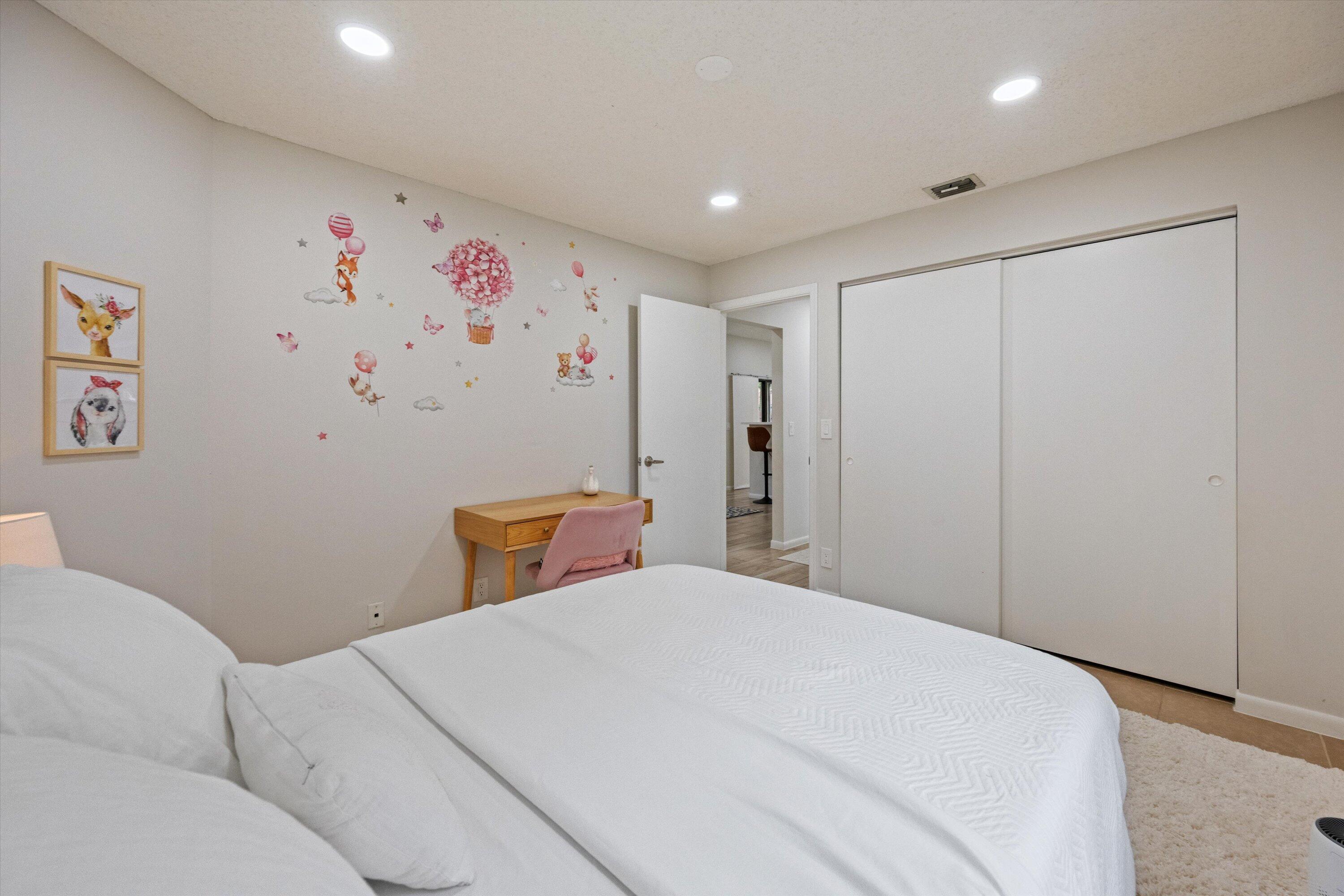 1769 Harborside Circle Wellington, FL 33414 - Photo 26 of 34 a bedroom with a bed and a refrigerator