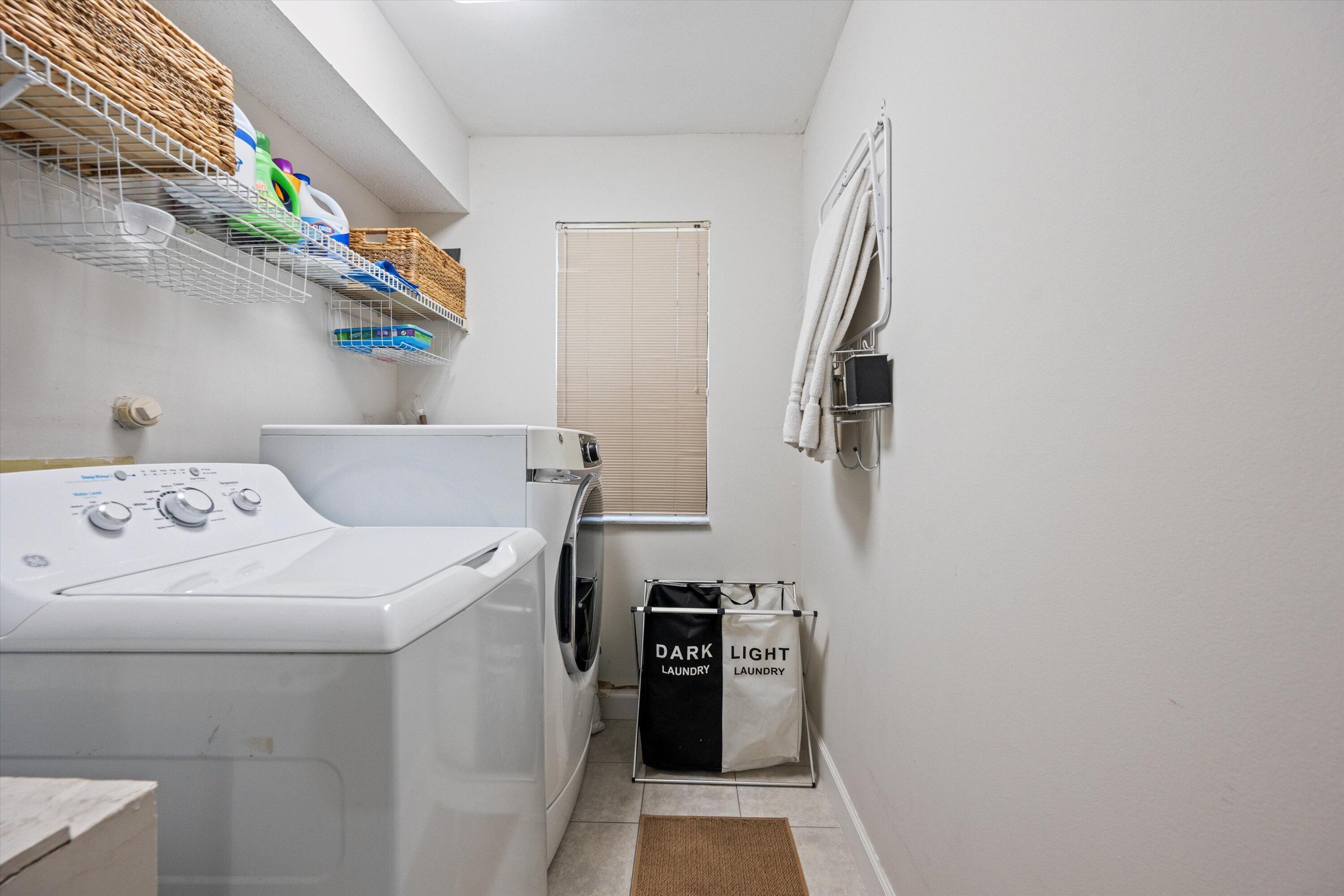1769 Harborside Circle Wellington, FL 33414 - Photo 27 of 34 a utility room with dryer and washer