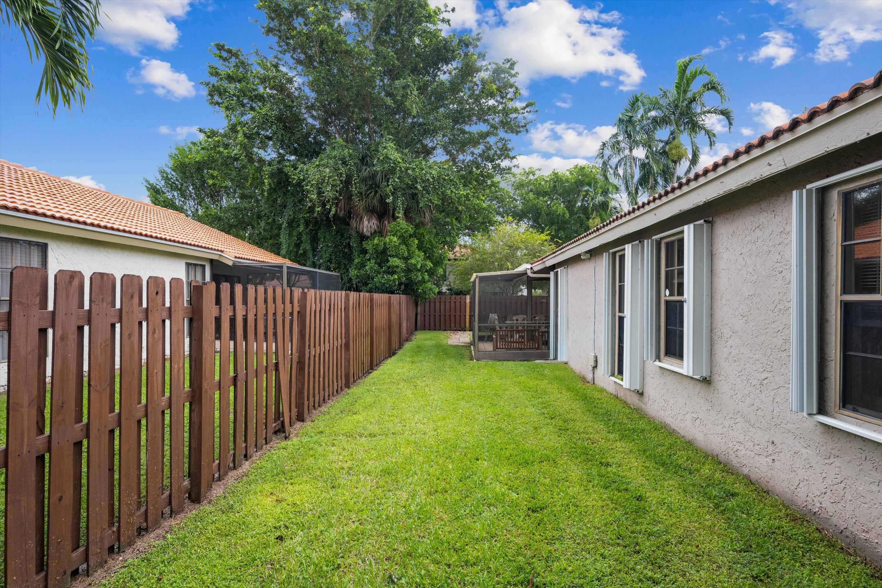 1769 Harborside Circle Wellington, FL 33414 - Photo 30 of 34 a view of a house with backyard and garden