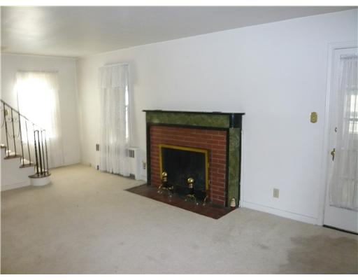 2190 Henry Road Sewickley Hills, PA 15143 - Photo 2 of 3 Exterior Front. Spacious living room with log fireplace. Door opens to family room which accesses rear deckl. Stairs to second floor bedrooms