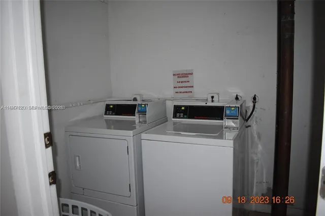 a utility room with dryer and washer