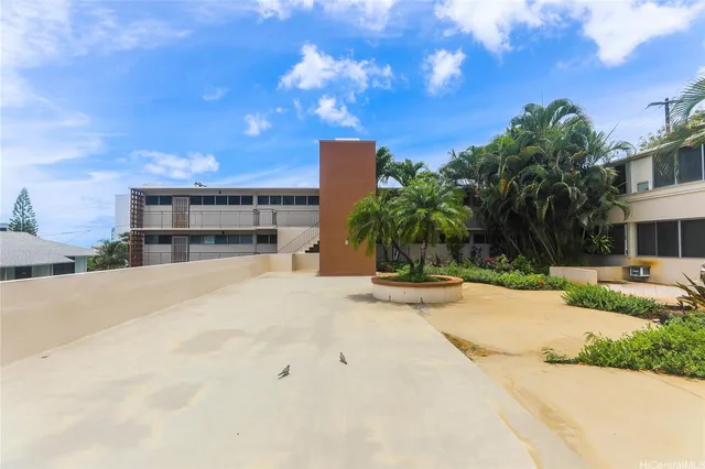 a house with palm tree in front of it