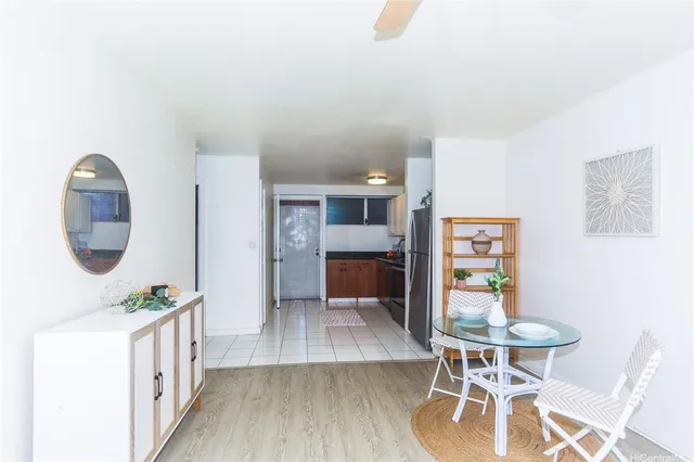 a kitchen with a table and chairs in it