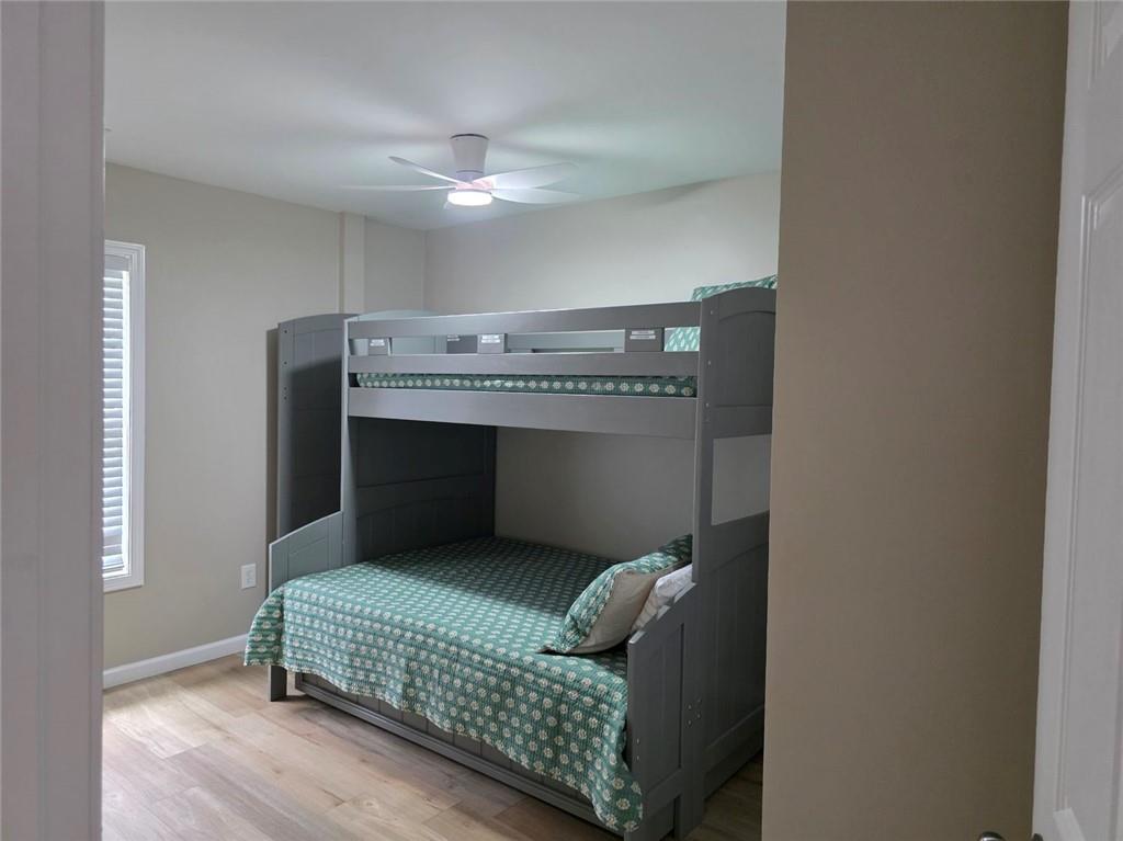 722 Lacy Street Monroe, GA 30655 - Photo 18 of 19 a bedroom with a bed and a ceiling fan