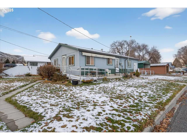 a house view with a backyard space