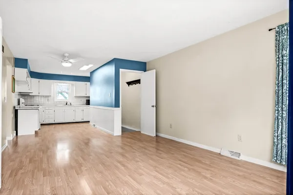 a view of kitchen with wooden floor