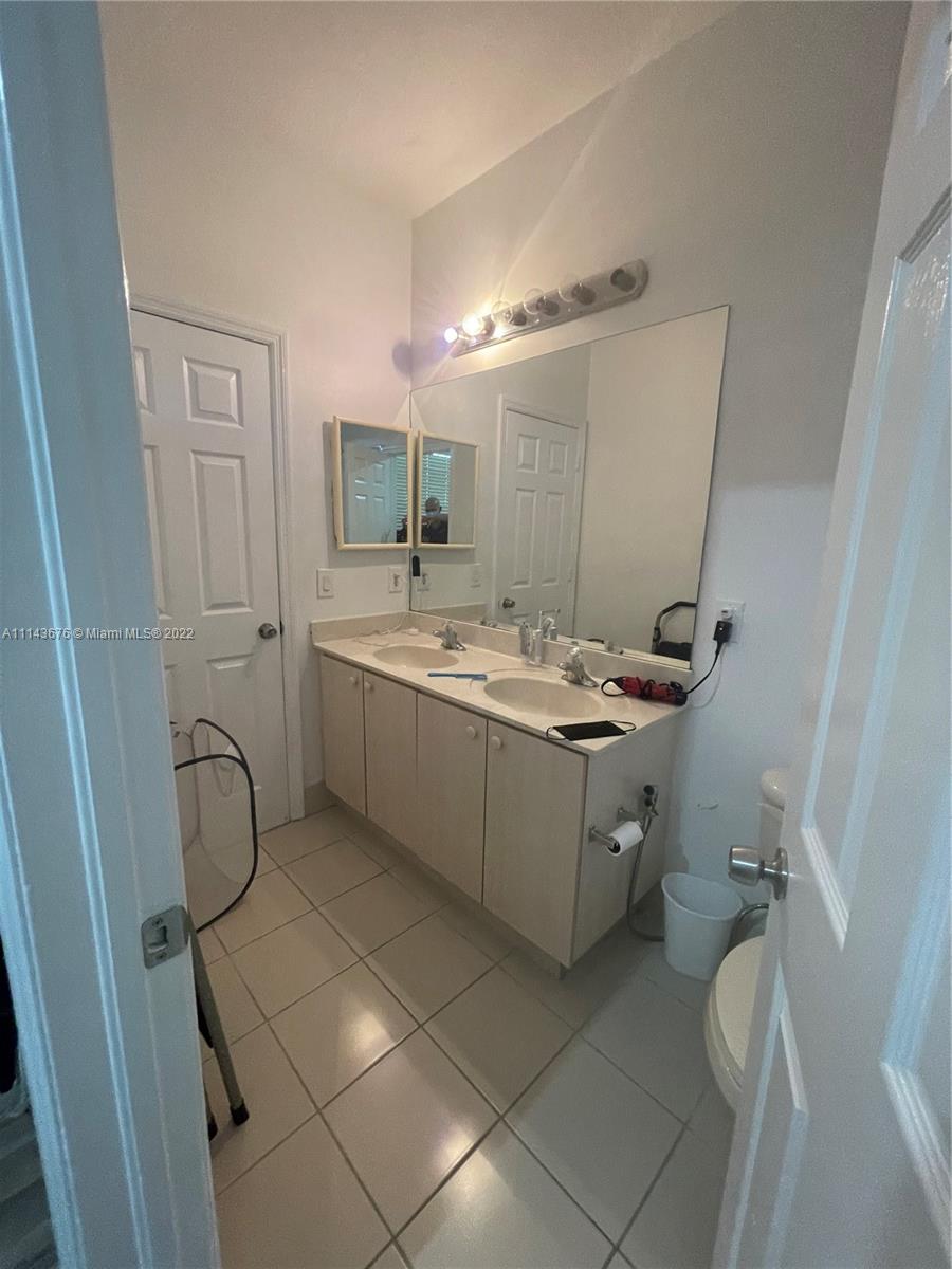 23744 Southwest 108th Court Homestead, FL 33032 - Photo 15 of 22 a room with a sink and a mirror