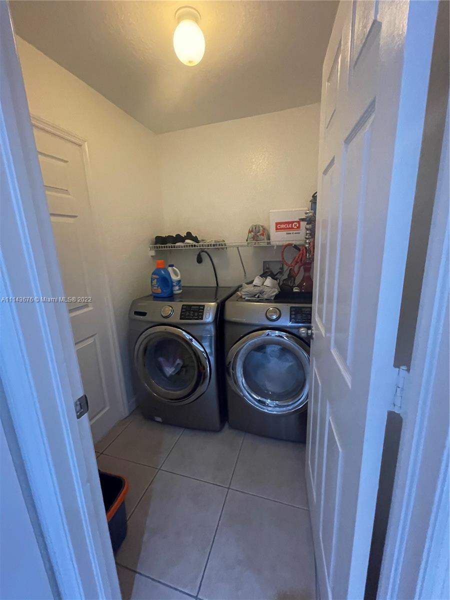 23744 Southwest 108th Court Homestead, FL 33032 - Photo 8 of 22 a utility room with sink dryer and washer