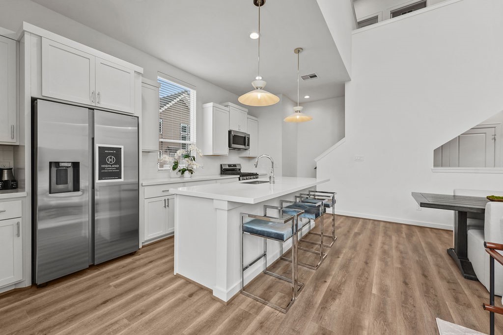 1208 Highland Row Lane Houston, TX 77091 - Photo 13 of 29 *Photos of staged model home. Finish package will feature blonde flooring with green and taupe cabinetry.