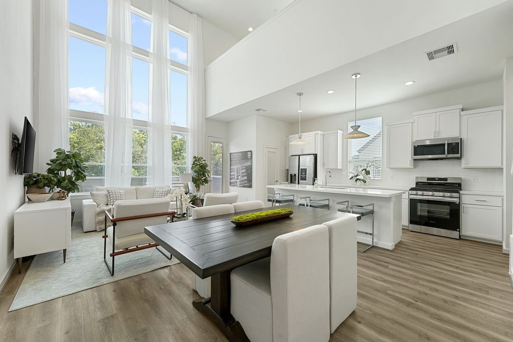 1208 Highland Row Lane Houston, TX 77091 - Photo 14 of 29 *Photos of staged model home. Finish package will feature blonde flooring with green and taupe cabinetry.