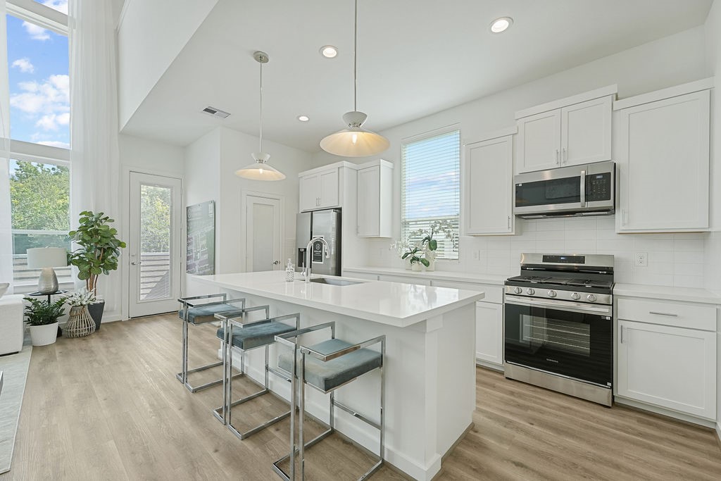 1208 Highland Row Lane Houston, TX 77091 - Photo 15 of 29 *Photos of staged model home. Finish package will feature blonde flooring with green and taupe cabinetry.