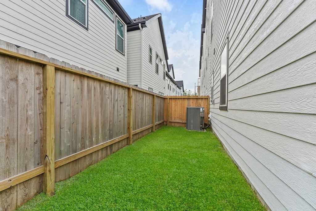 1208 Highland Row Lane Houston, TX 77091 - Photo 26 of 29 *Photos of staged model home. Finish package will feature blonde flooring with green and taupe cabinetry.