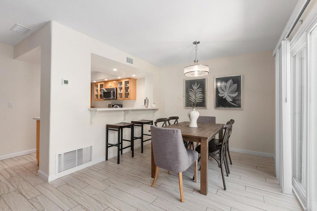2992 Brandon Circle Carlsbad, CA 92010 - Photo 12 of 69 a view of a dining room with furniture and wooden floor