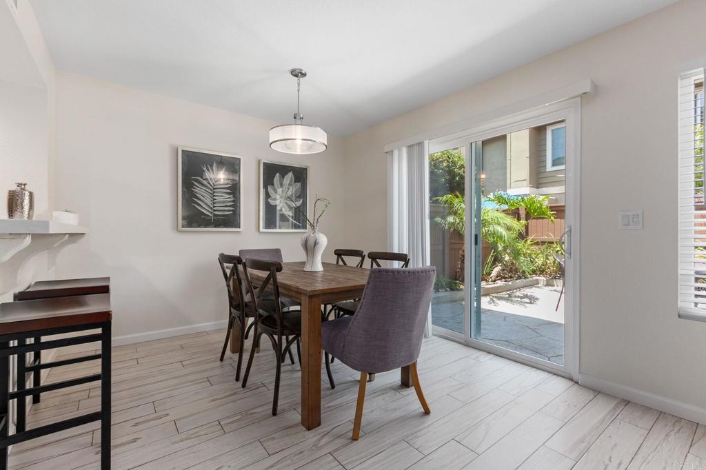 2992 Brandon Circle Carlsbad, CA 92010 - Photo 13 of 69 a view of a dining room with furniture window and wooden floor