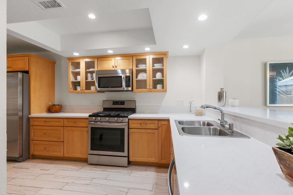 2992 Brandon Circle Carlsbad, CA 92010 - Photo 14 of 69 a kitchen with a stove and a sink