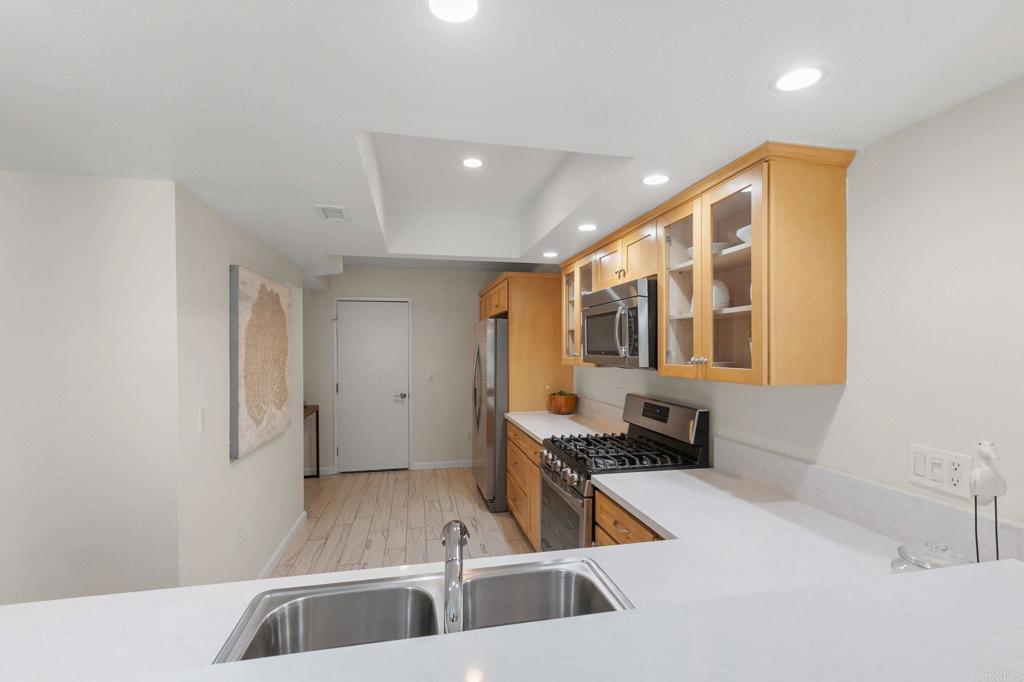 2992 Brandon Circle Carlsbad, CA 92010 - Photo 15 of 69 a kitchen with a sink and a refrigerator