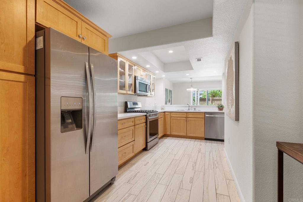 2992 Brandon Circle Carlsbad, CA 92010 - Photo 16 of 69 a kitchen with stainless steel appliances a refrigerator sink and stove
