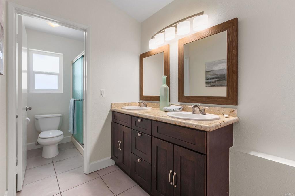 2992 Brandon Circle Carlsbad, CA 92010 - Photo 23 of 69 a bathroom with a sink and a mirror