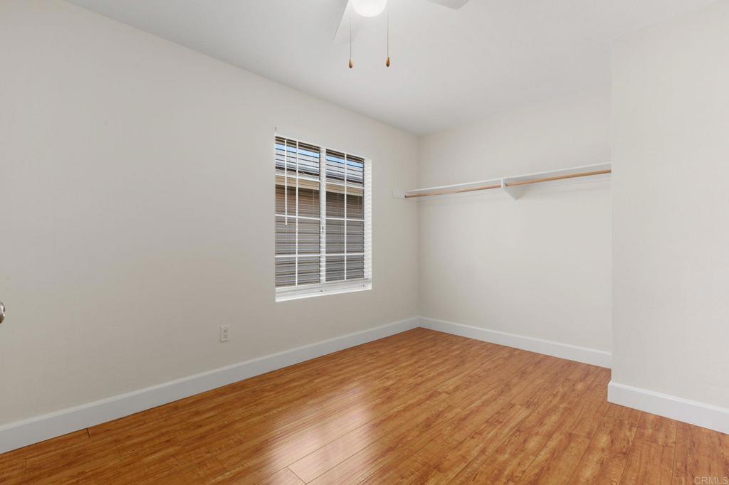 2992 Brandon Circle Carlsbad, CA 92010 - Photo 25 of 69 an empty room with wooden floor and windows