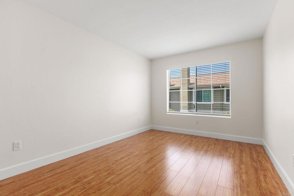 2992 Brandon Circle Carlsbad, CA 92010 - Photo 30 of 69 wooden floor in an empty room with a window