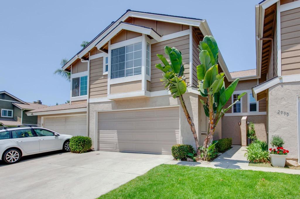 2992 Brandon Circle Carlsbad, CA 92010 - Photo 3 of 69 a front view of a house with garden