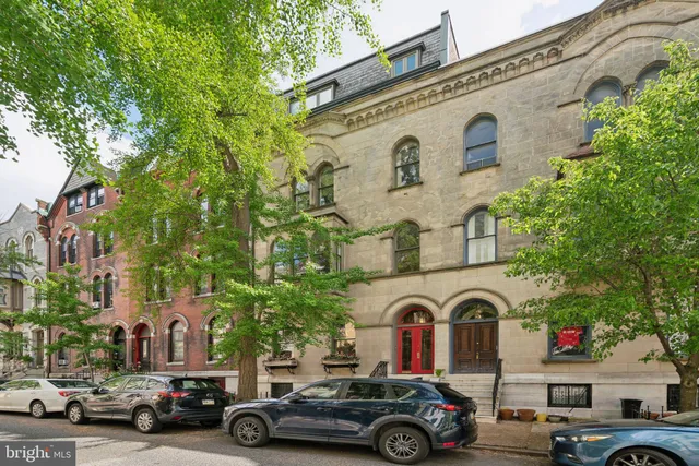 a front view of a building with parking space