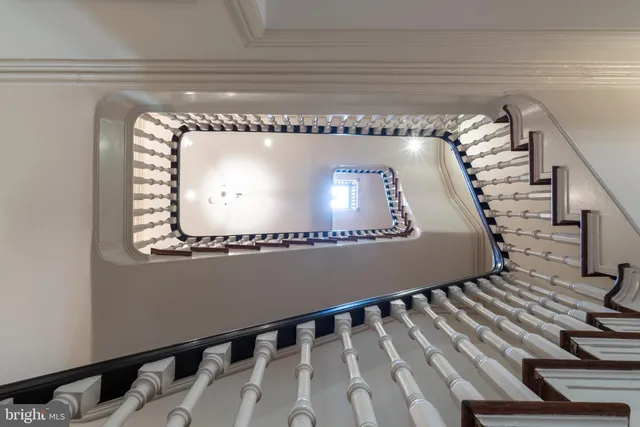 a living room with furniture fireplace and a window