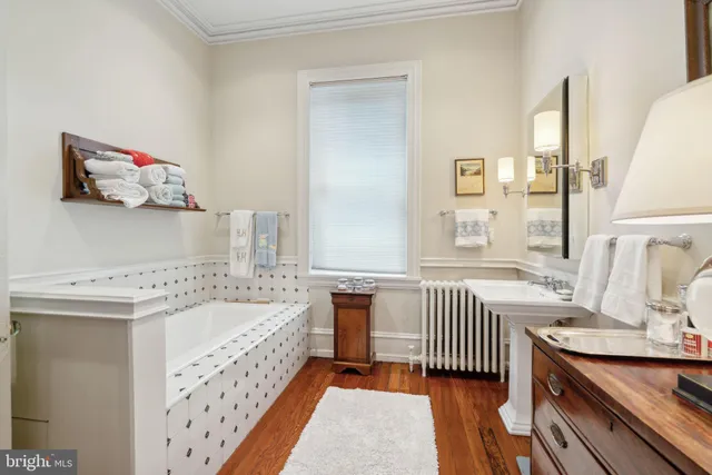 a view of room with lots of books