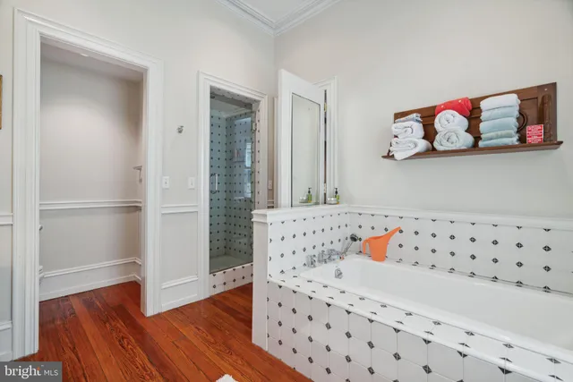 a bed room with a bed and a chair