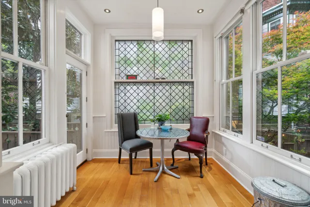 a dining room with furniture and window