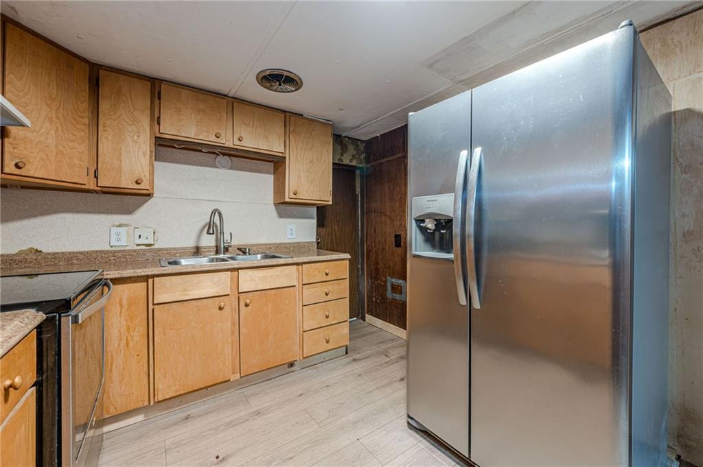 90 Valley Trail Southeast Acworth, GA 30101 - Photo 13 of 28 a kitchen with stainless steel appliances granite countertop a refrigerator and a sink