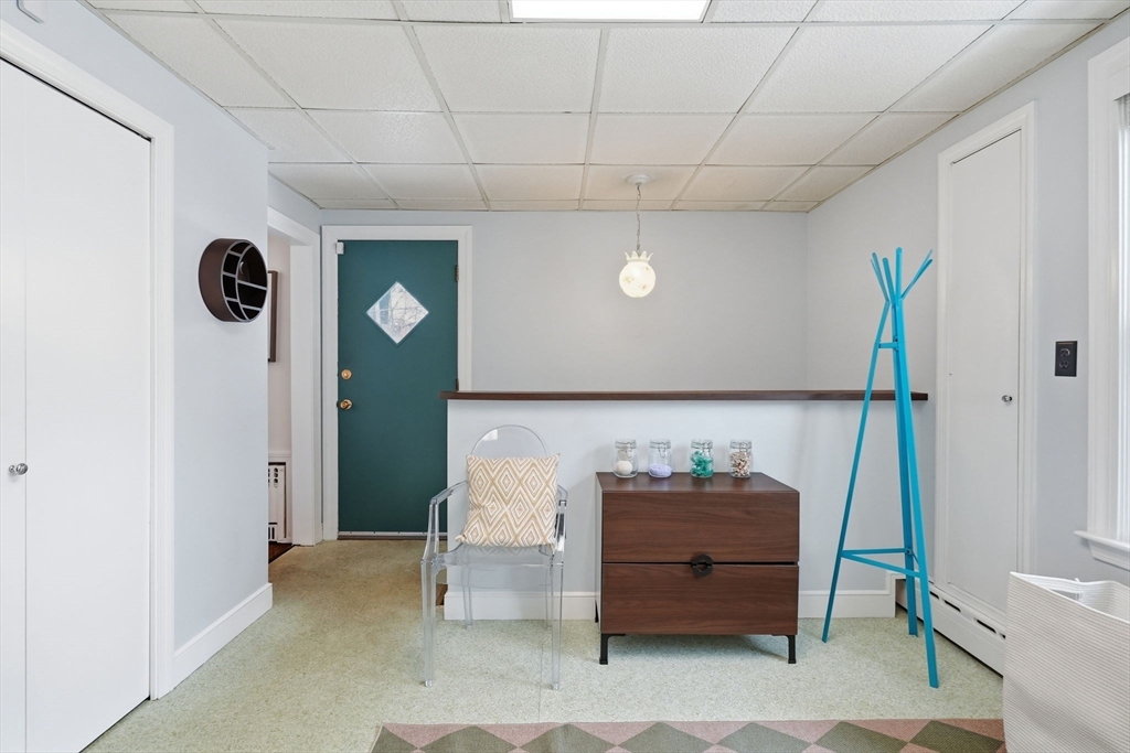 17 Vogel Street Boston, MA 02132 - Photo 22 of 43 a living room with a couch and a table