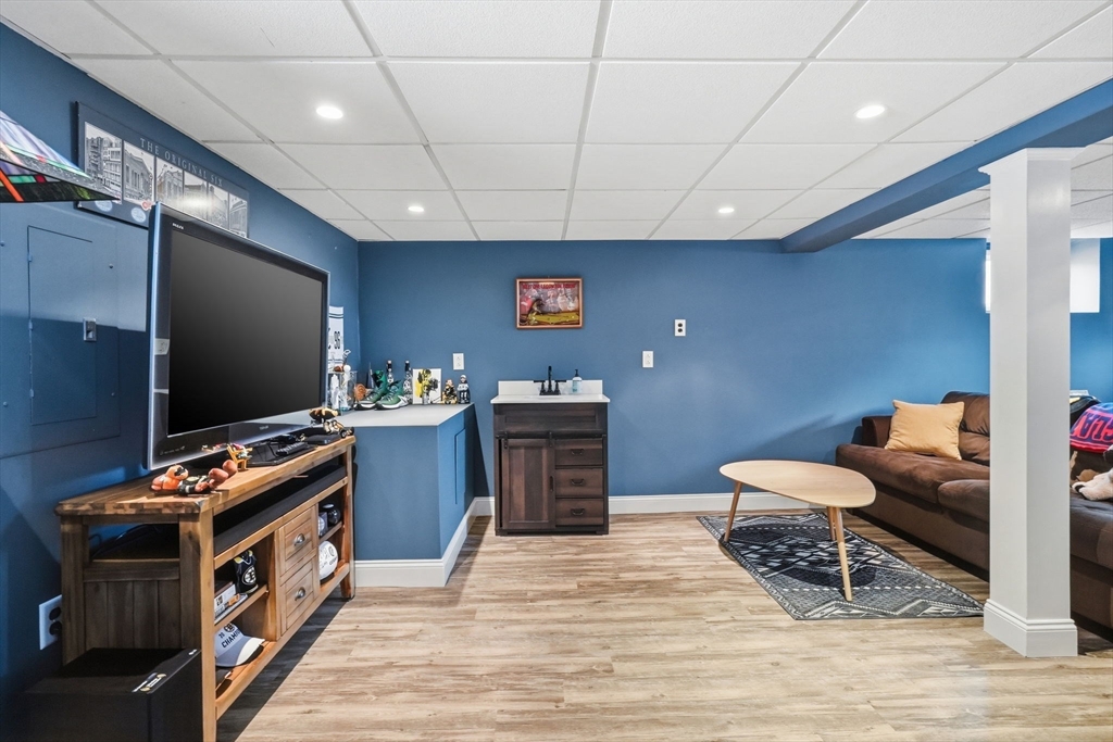 17 Vogel Street Boston, MA 02132 - Photo 23 of 43 a room with furniture and a flat screen tv