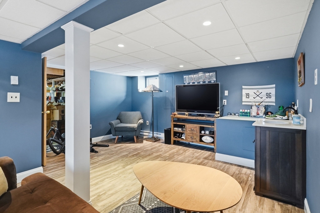 17 Vogel Street Boston, MA 02132 - Photo 24 of 43 a living room with furniture and a flat screen tv