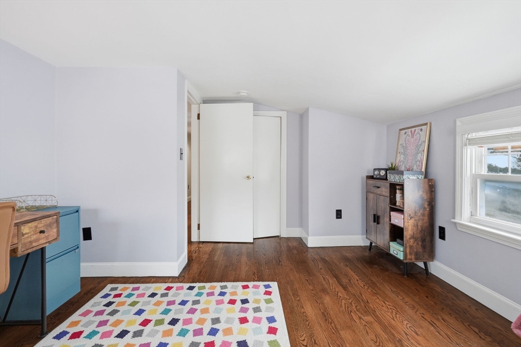 17 Vogel Street Boston, MA 02132 - Photo 28 of 43 a bedroom with a bed and a window