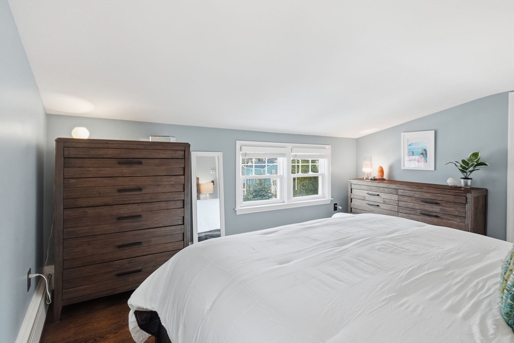 17 Vogel Street Boston, MA 02132 - Photo 32 of 43 a bedroom with a bed and a dresser