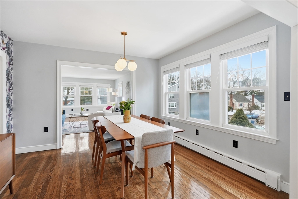 17 Vogel Street Boston, MA 02132 - Photo 6 of 43 a dining room with furniture a chandelier and wooden floor