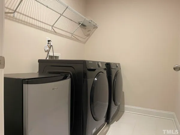a view of storage and utility room with a washer and dryer