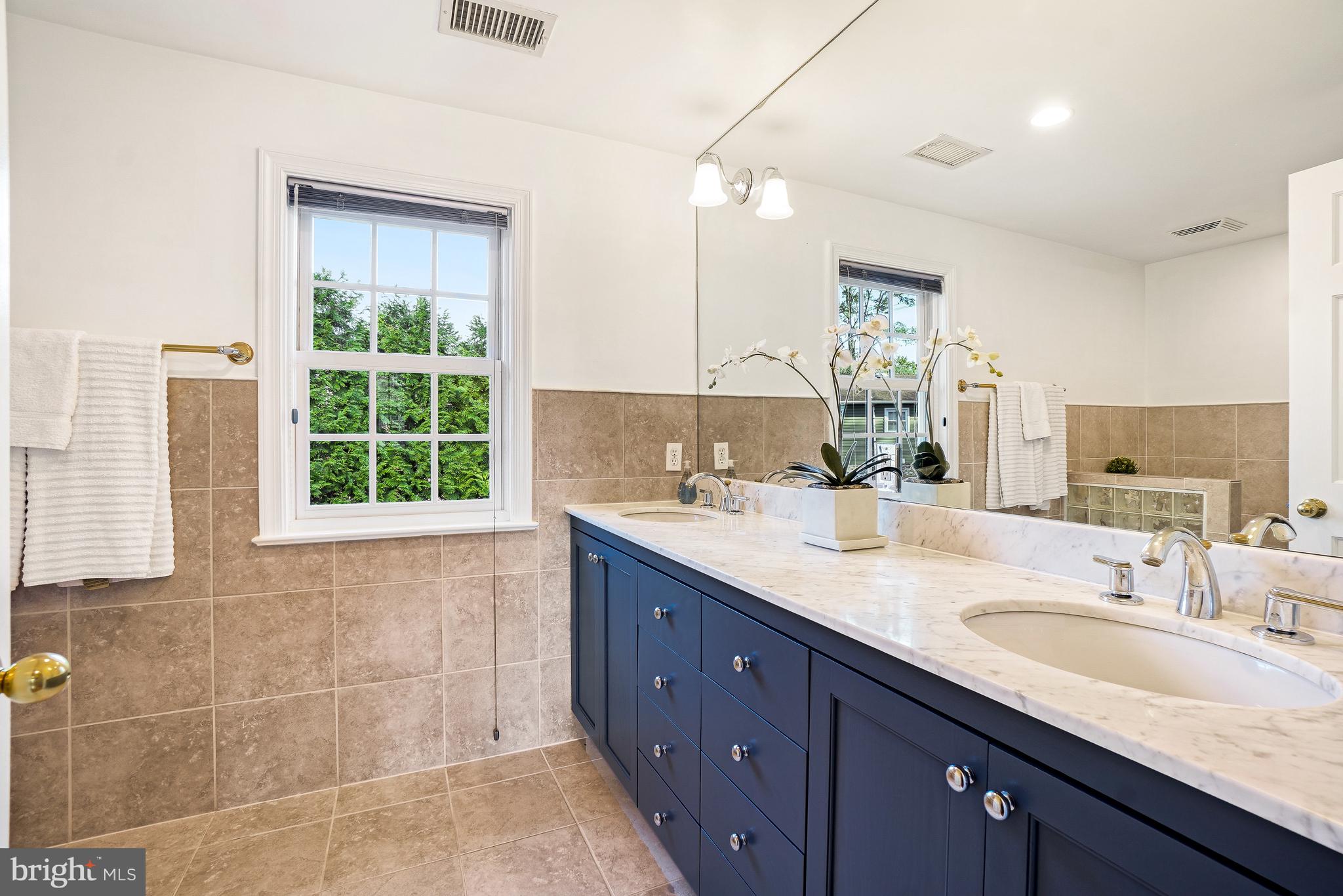 9502 Edgeley Road Bethesda, MD 20814 - Photo 21 of 46 Primary bath with marble top double sink vanity