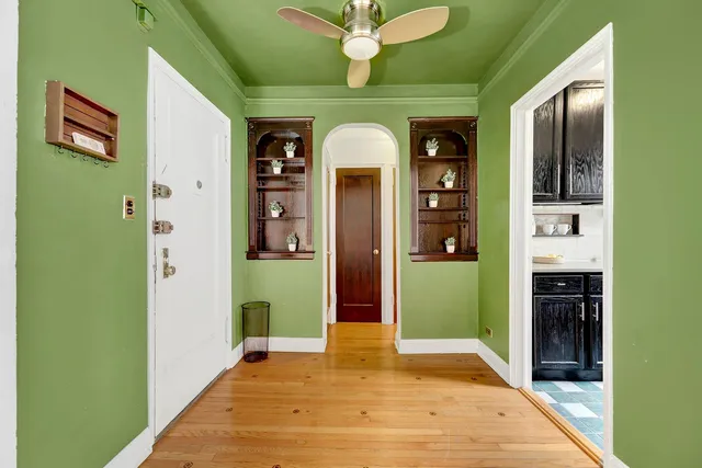 a view of an entryway door with a hallway