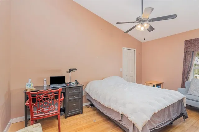 a bedroom with a bed and a tv on the dresser