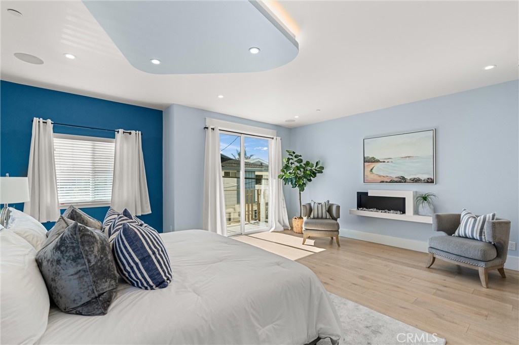 16760 A Bayview Drive Sunset Beach, CA 90742 - Photo 27 of 53 a bedroom with a bed and furniture
