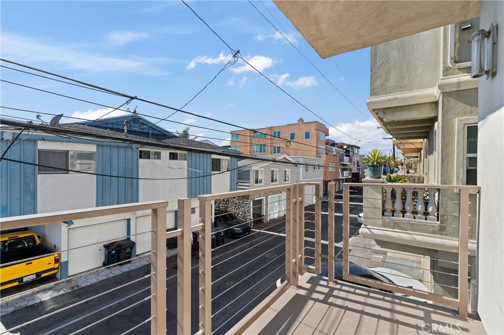 16760 A Bayview Drive Sunset Beach, CA 90742 - Photo 34 of 53 a view of a balcony with car parked