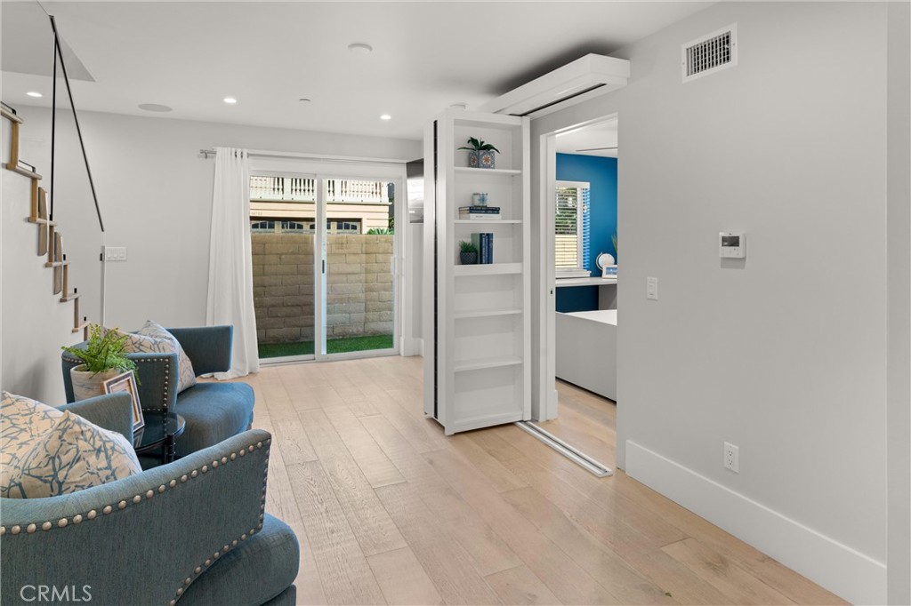 16760 A Bayview Drive Sunset Beach, CA 90742 - Photo 35 of 53 a living room with furniture and a potted plant