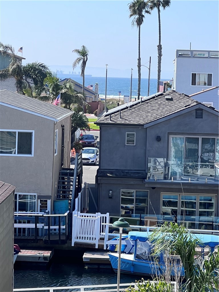 16760 A Bayview Drive Sunset Beach, CA 90742 - Photo 5 of 53 a front view of a house with a garden and plants